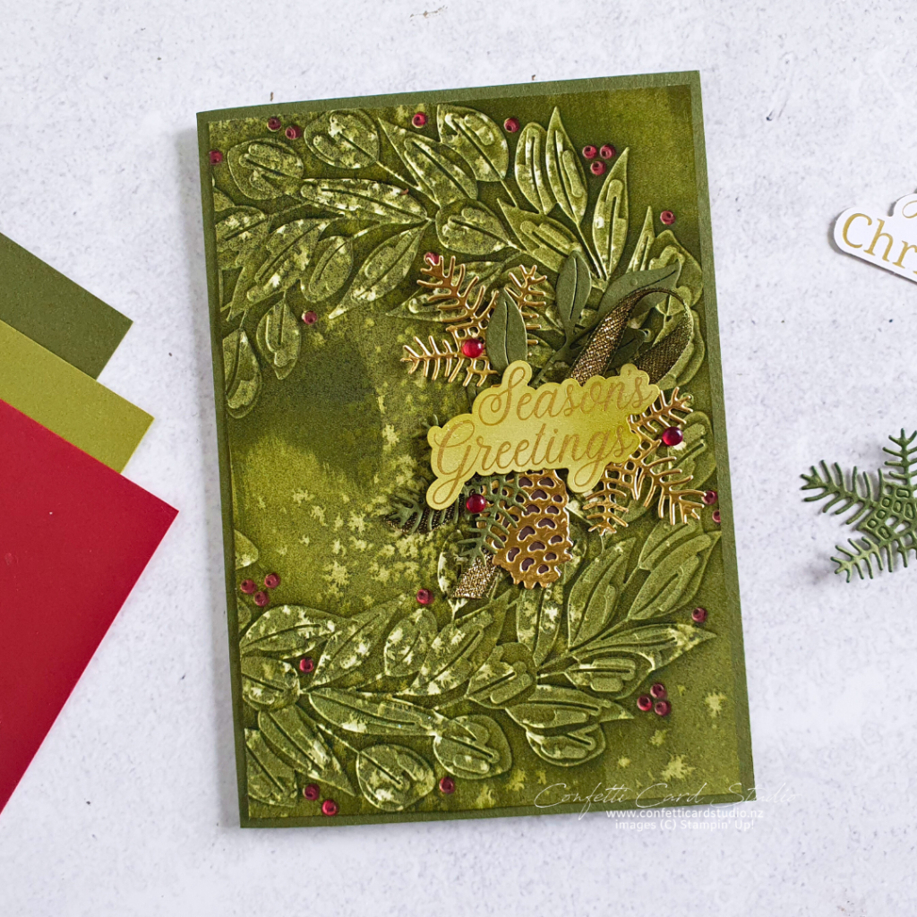 Handmade traditional wreath embossing ink magic Christmas card.
