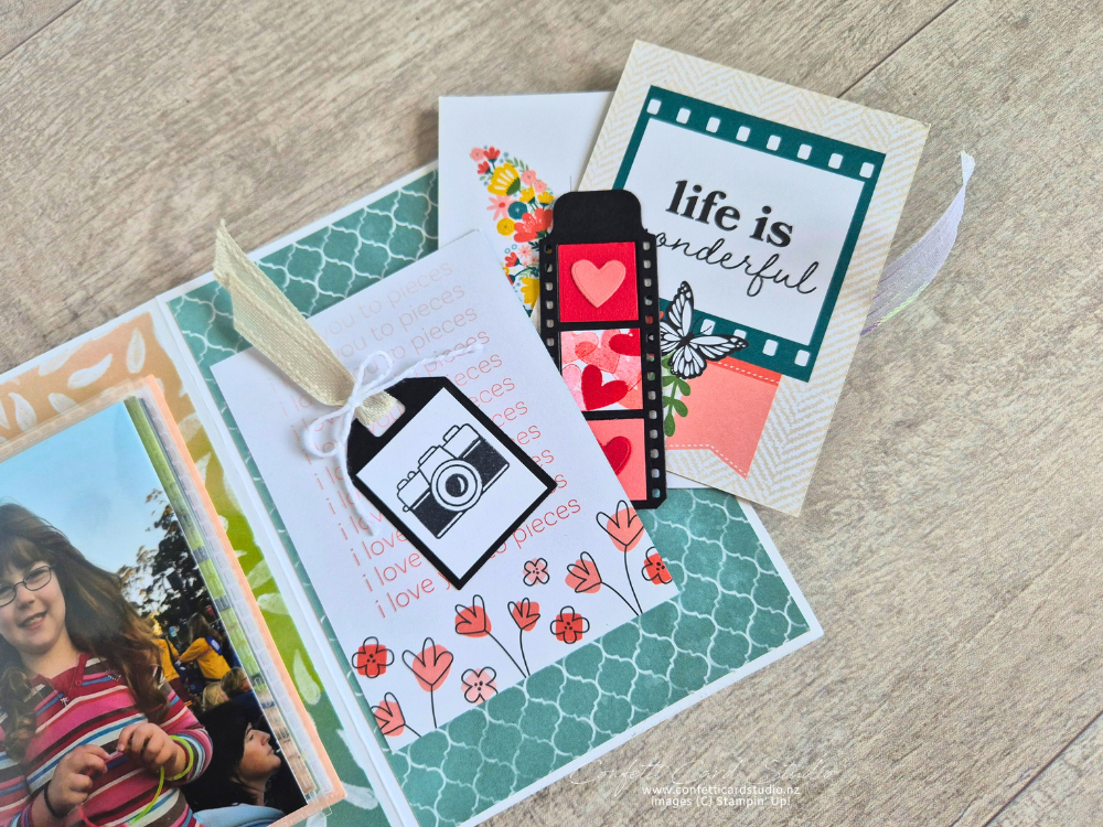 Card page featuring a tuck point for more photos