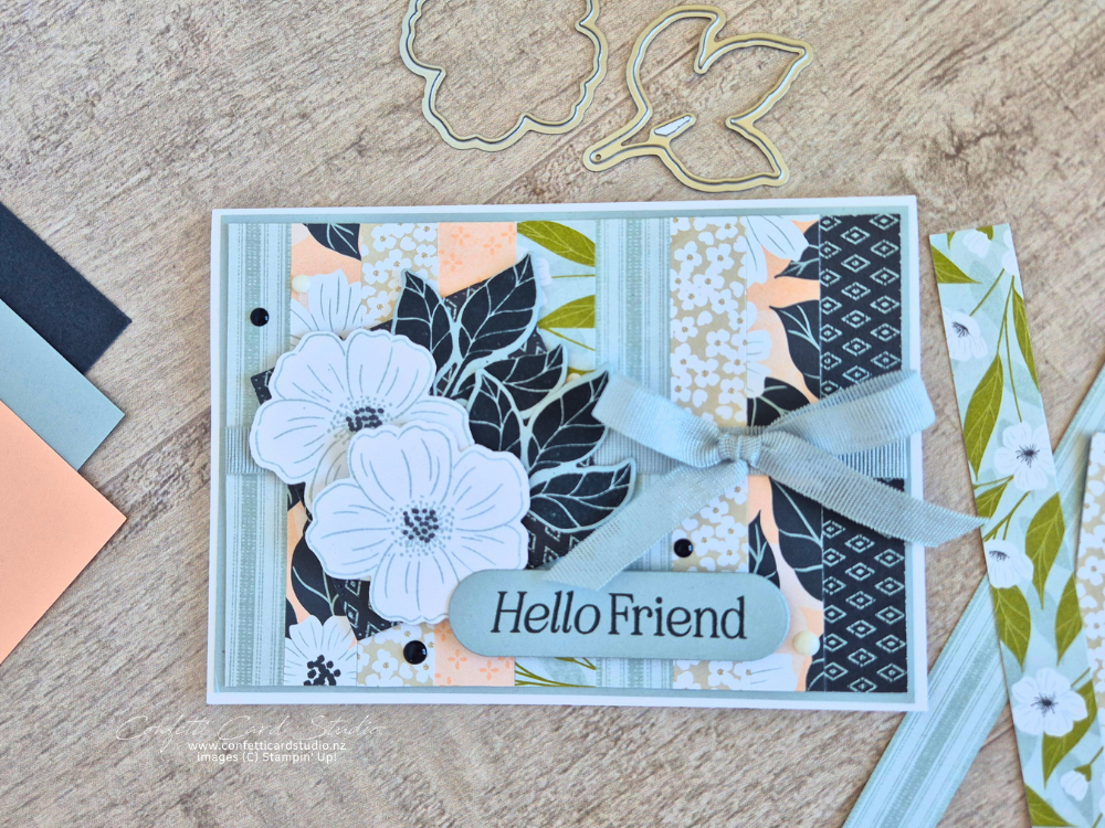 Handmade card using scraps of Lovely Blossoms DSP in cloud cover, secret sea and petal pink, featuring blossom flowers, leaves and a cloud cover ribbon bow.