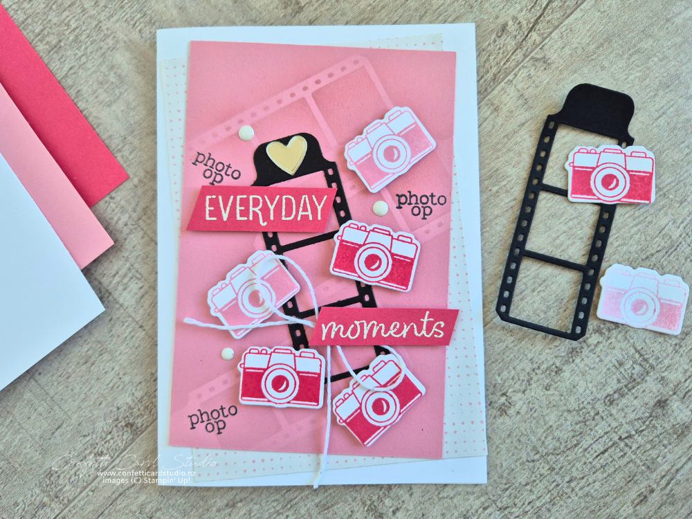Handmade card featuring the Capturing Smiles Bundle with colourful camera die cuts, sponged film strip background, layered patterned paper, and memories theme.