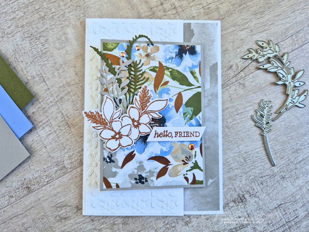 Delicate Whispers Z Fold Card featuring floral designer paper, embossed panel, and bronze accents in soft blue and green tones.