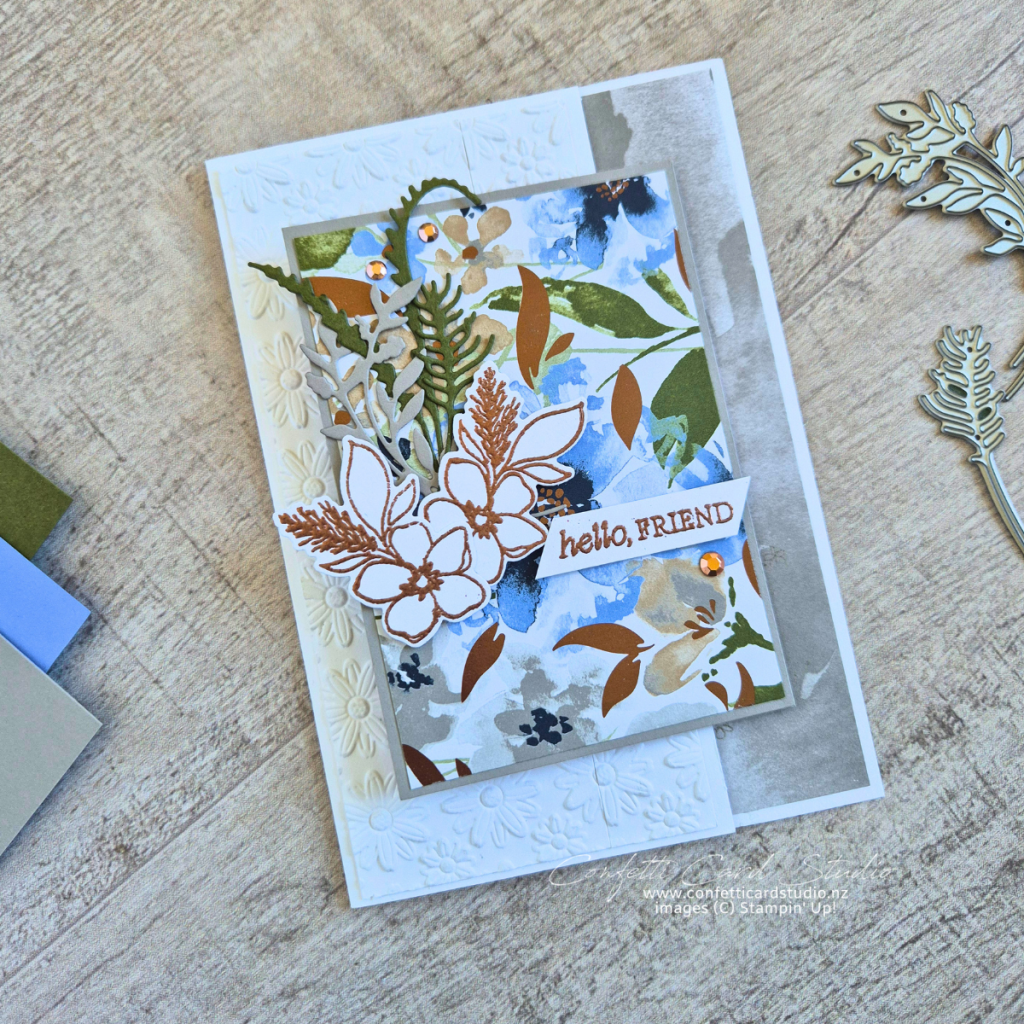 Delicate Whispers Z Fold Card featuring floral designer paper, embossed panel, and bronze accents in soft blue and green tones.