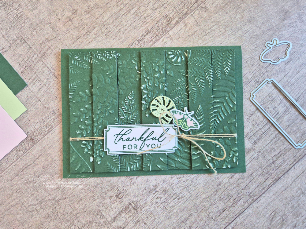 Handmade Fern & Flora Double Vision Card featuring embossed Peaceful Pine cardstock, layered fern strips, a moth embellishment, and textured botanical details.