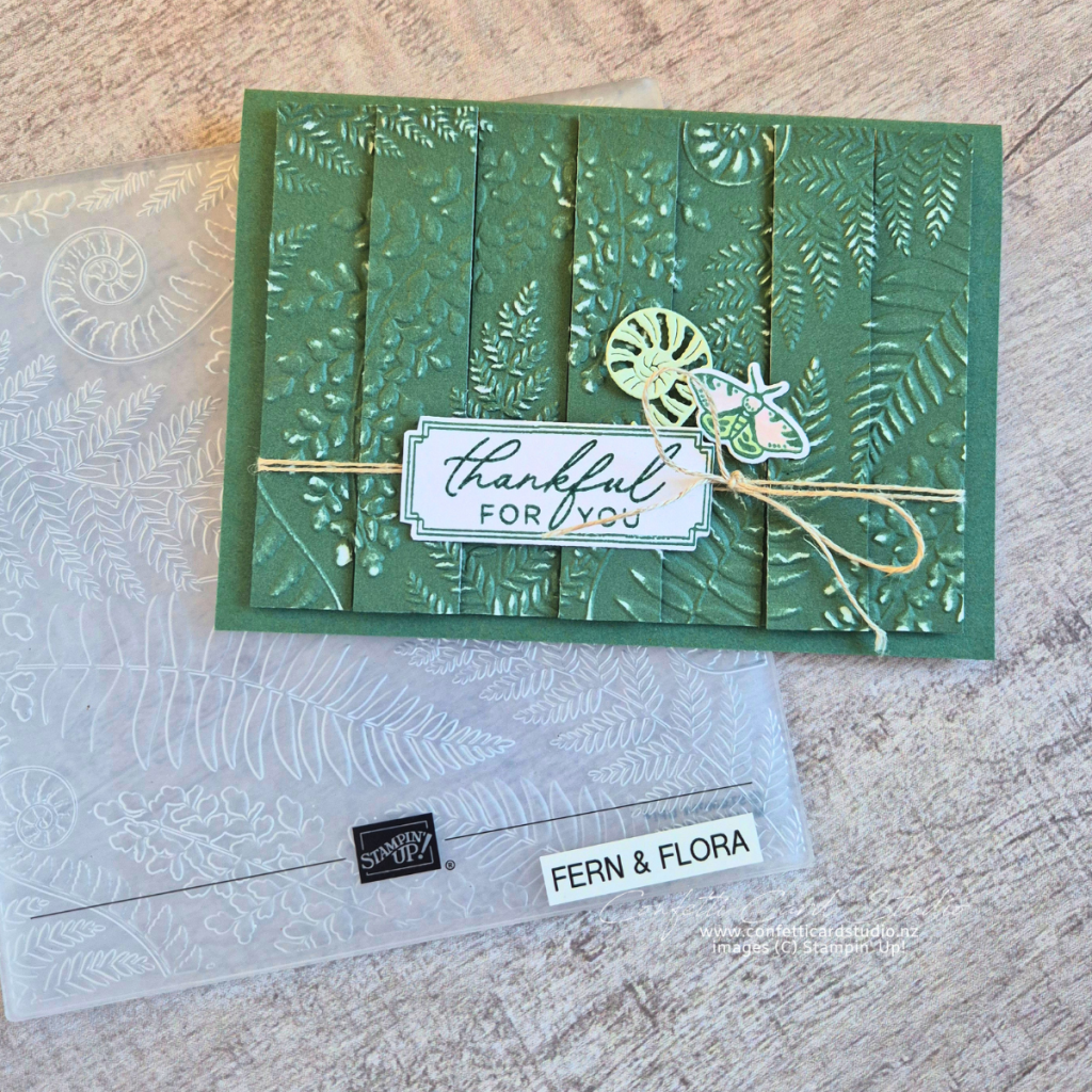 Handmade Fern & Flora Double Vision Card featuring embossed Peaceful Pine cardstock, layered fern strips, a moth embellishment, and textured botanical details.