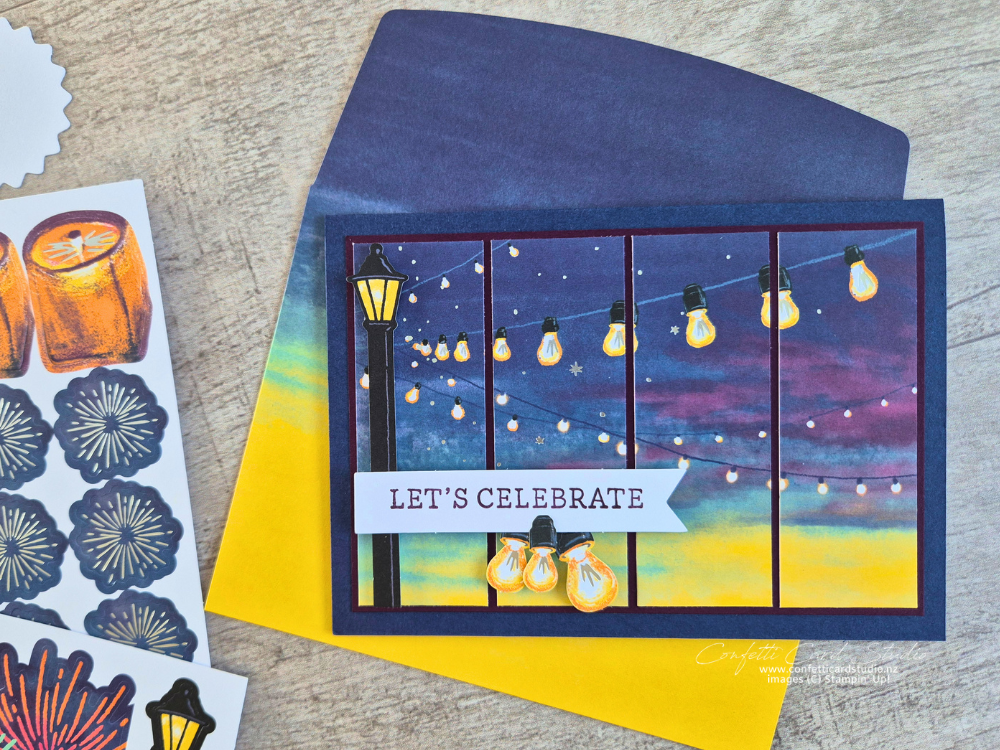 An alternative handmade card created with the May 2026 Sparkling Celebrations Paper Pumpkin kit featuring festoon lights, dusk coloured background and cut to create a shutter effect.