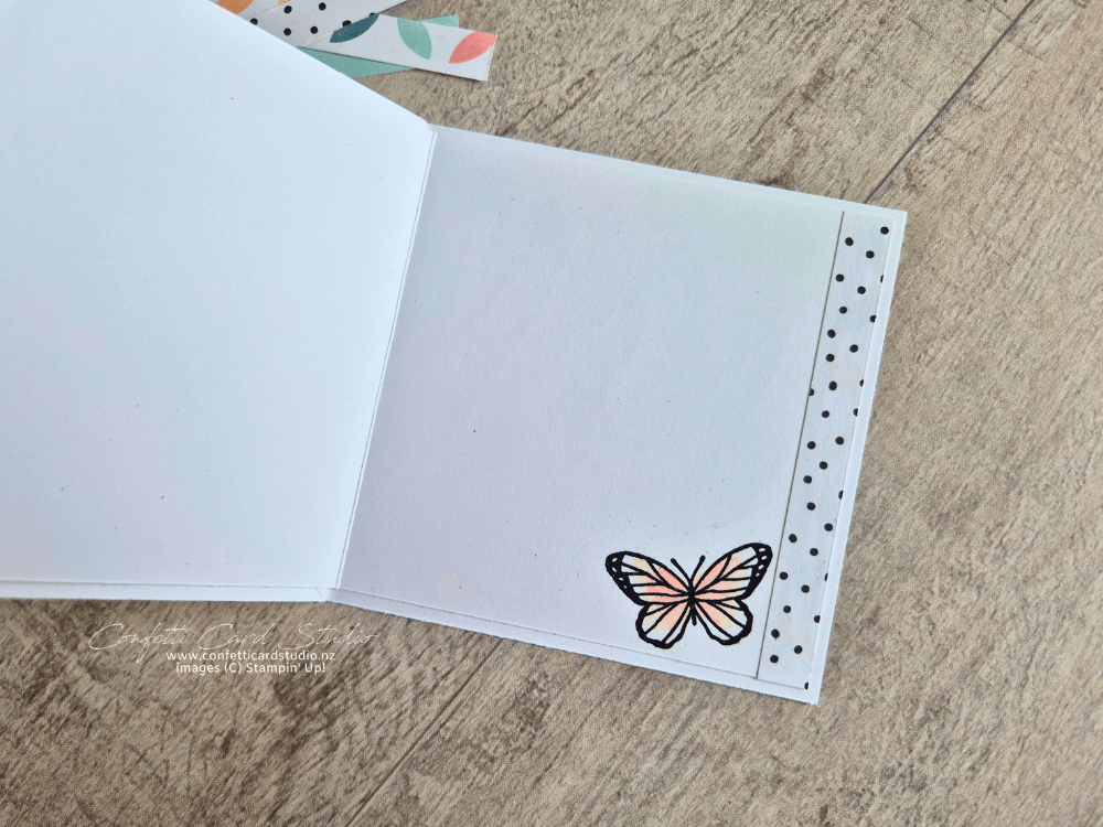 Stampin' Up! Beautiful Ordinary Life twisted easel card displayed open. Decorated with watercoloured butterflies and flowers. Inner Section for message with strip of back dots paper and butterfly decoration