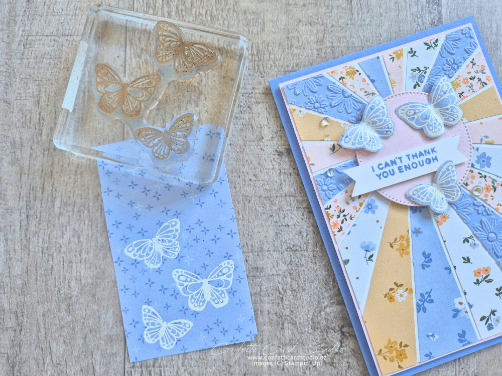 Handmade card featuring white embossed butterflies stamped on Bloom Boutique DSP