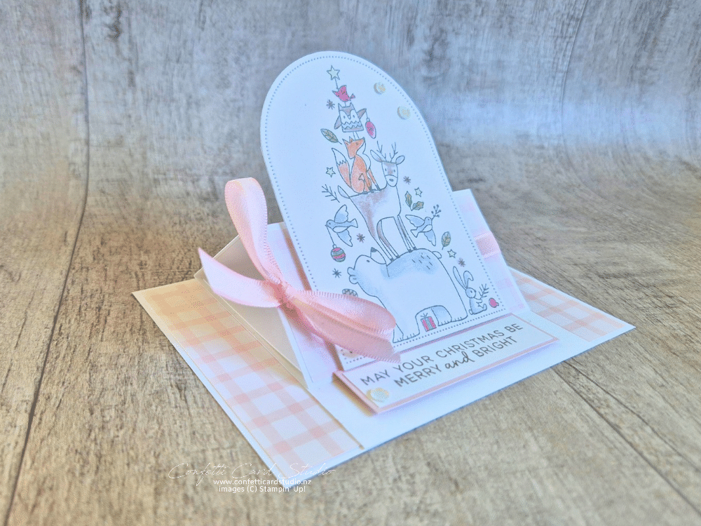 Side view of Woodland Wishes easel Christmas card featuring a fox, deer, bear and other woodland animals